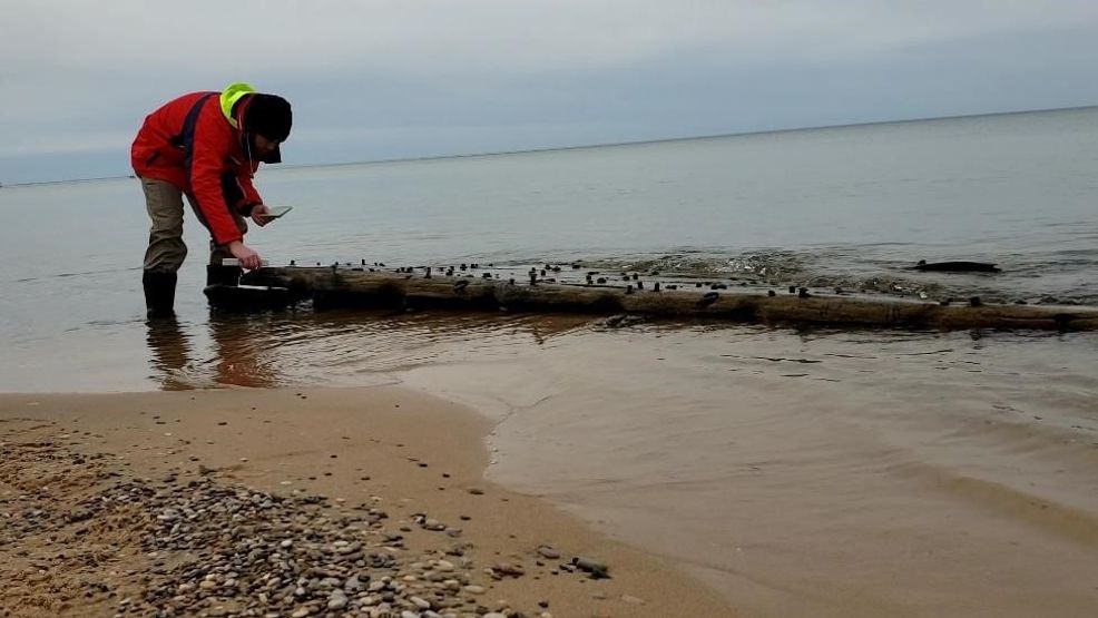 High water reveals shipwreck remains buried on Lake Michigan beach - UpNorthLive.com