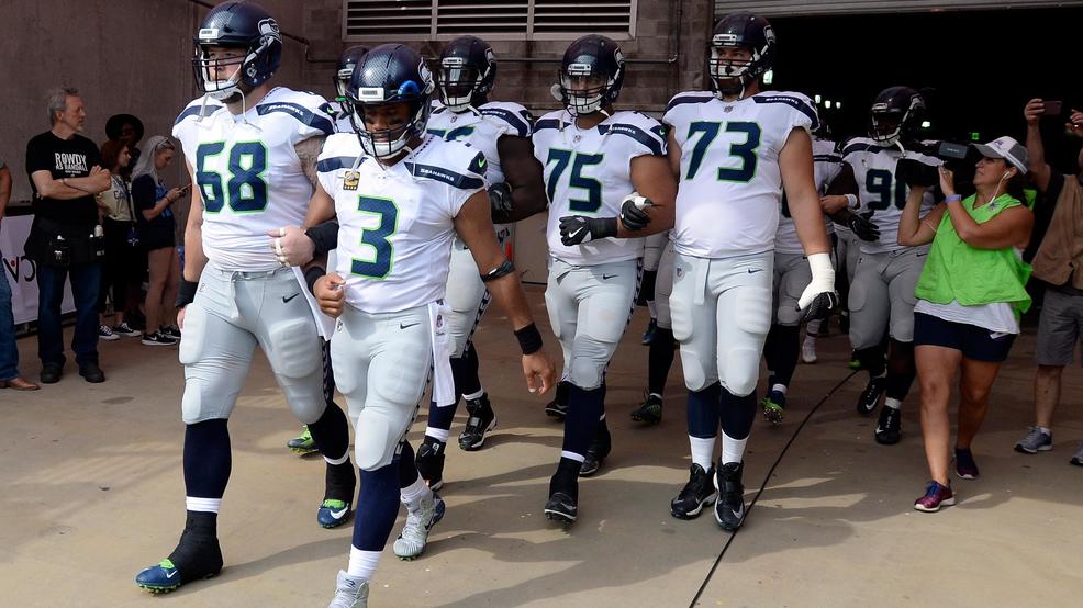 Seahawks Titans Football Seahawks lock arms tunnel Tennessee AP2.jpg