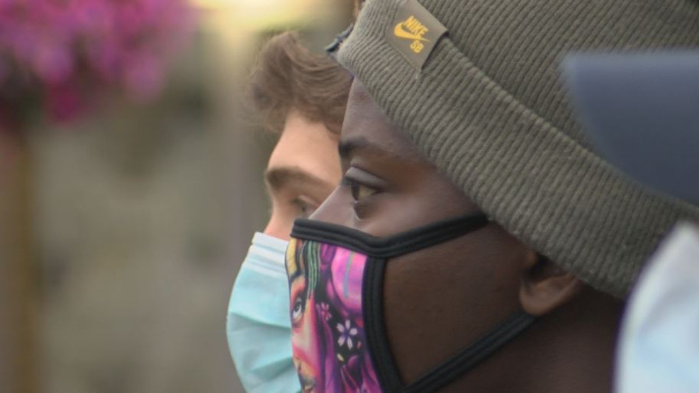 Protesters lock arms in solidarity to protect businesses sans weapons